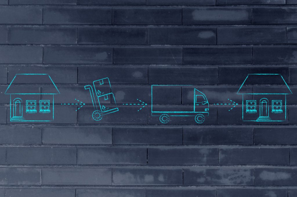 moving: packing boxes from the old house for the movers to deliver them at the new house